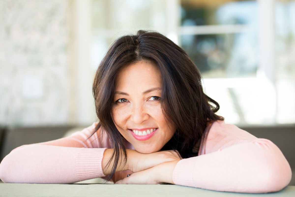 middle aged asian woman with long hair
