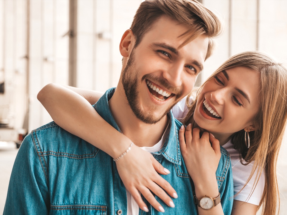 Confident man and woman smiling