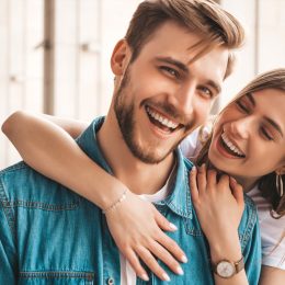 Confident man and woman smiling