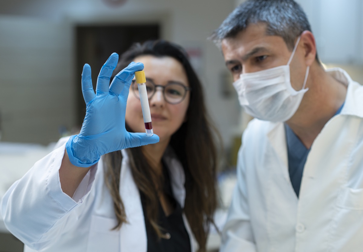 Female and male doctors analyzing medical samples in a lab