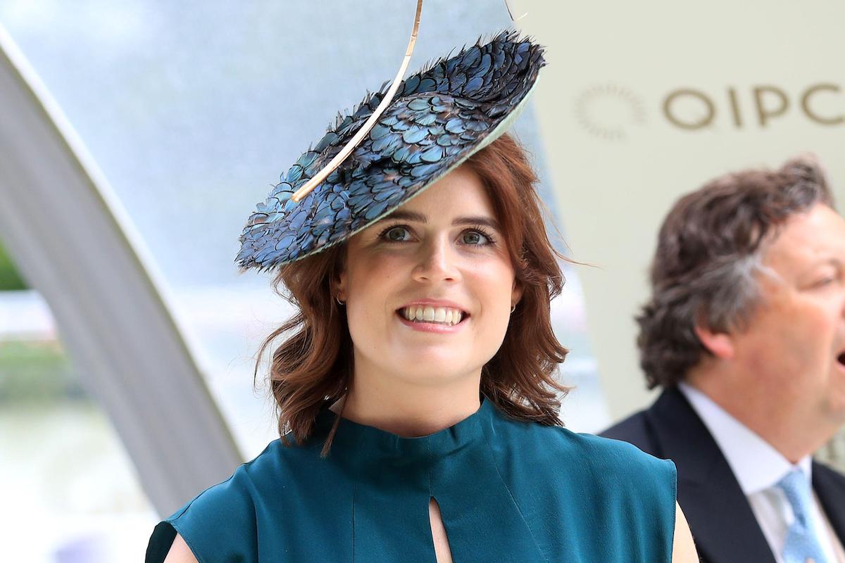 Princess Eugenie wearing turquoise dress and big hat