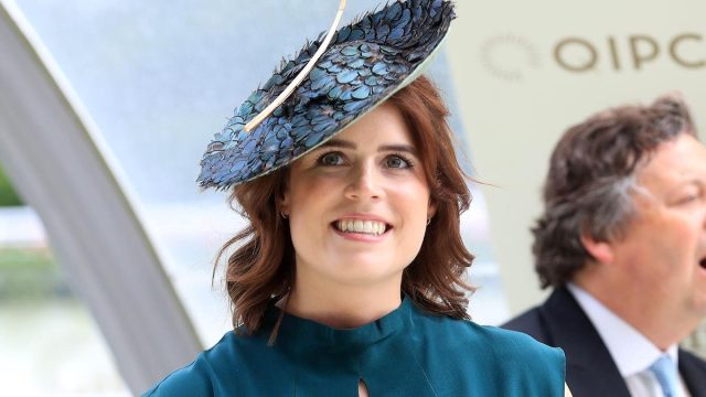 Princess Eugenie wearing turquoise dress and big hat