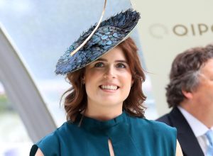 Princess Eugenie wearing turquoise dress and big hat