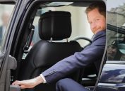 Prince Harry, The Duke of Sussex closes the car door as he leaves the twelfth annual Lord Mayor's Big Curry Lunch in aid of the three National Service Charities