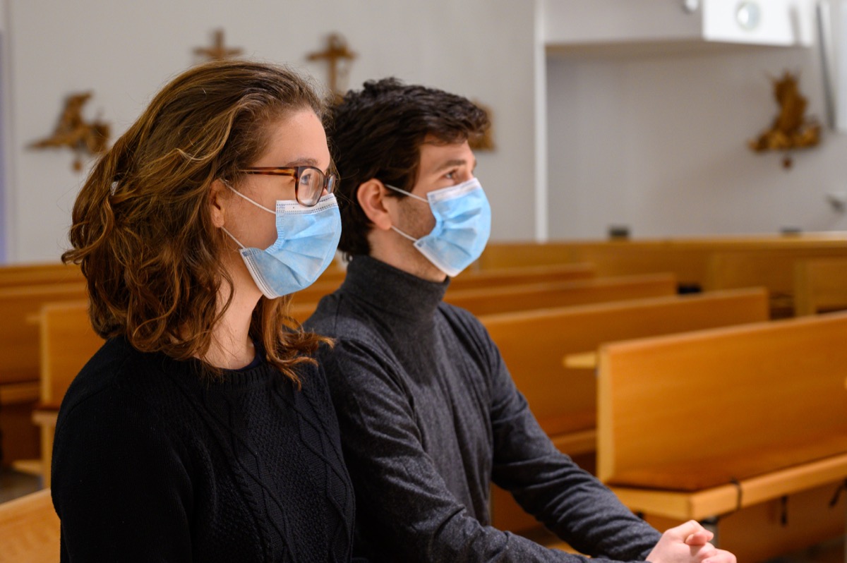 People wearing masks in church