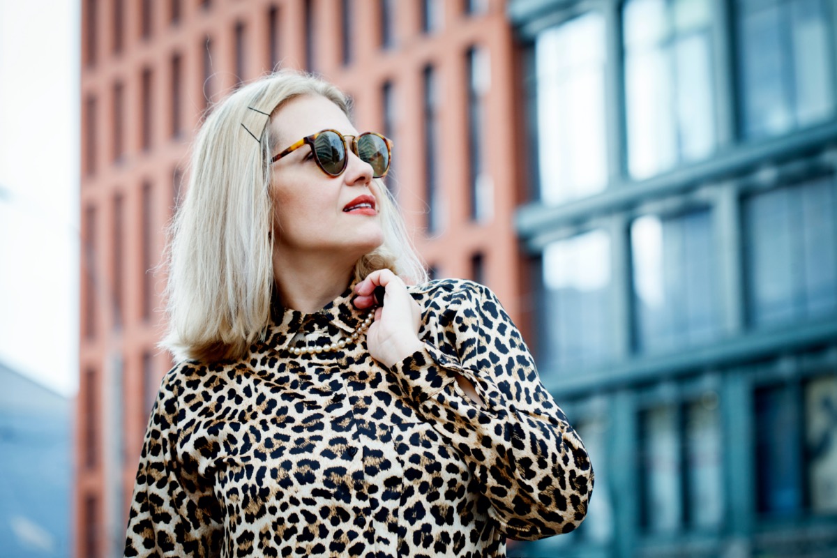 white middle aged woman wearing leopard dress