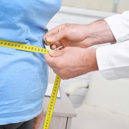 Person with obesity being measured
