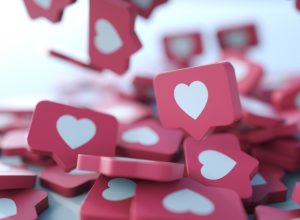 A pile of 3D "like" heart icons similar to the ones seen on Instagram