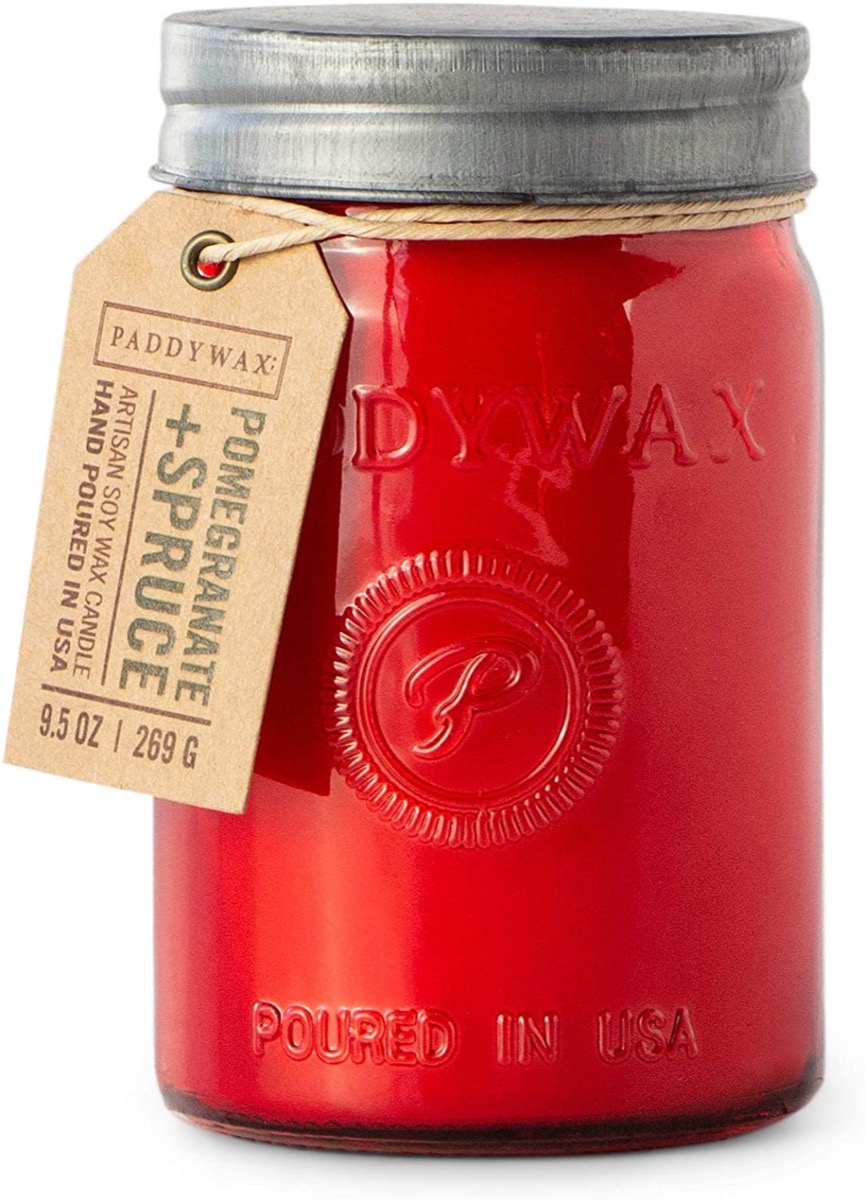 red glass jar with candle inside