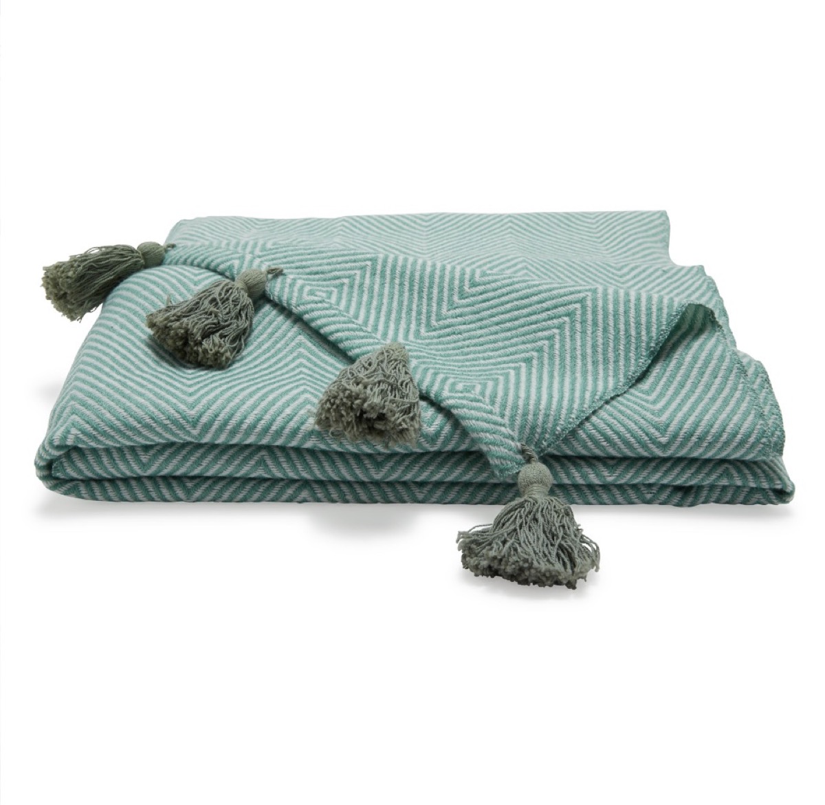 green throw with tassels