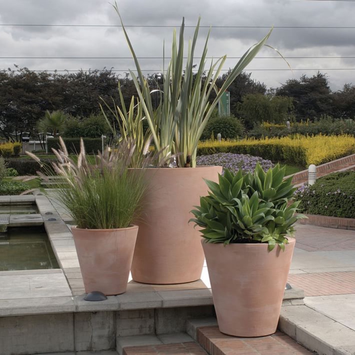 brown ceramic planters outside of home