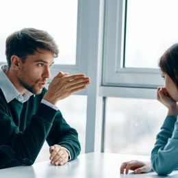 white couple or coworkers arguing