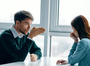 white couple or coworkers arguing