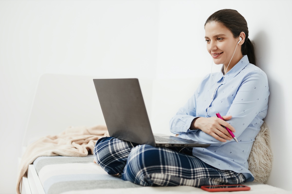 woman wearing pajamas on video call