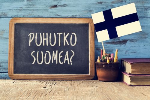 "Do you speak Finnish" in Finnish on chalkboard
