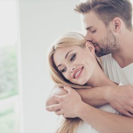 Attractive couple man smelling woman's hair