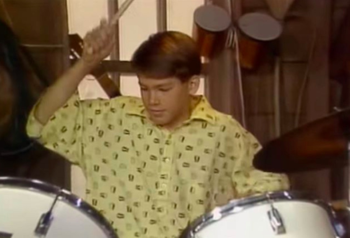 Young Ryan Reynolds playing the drums