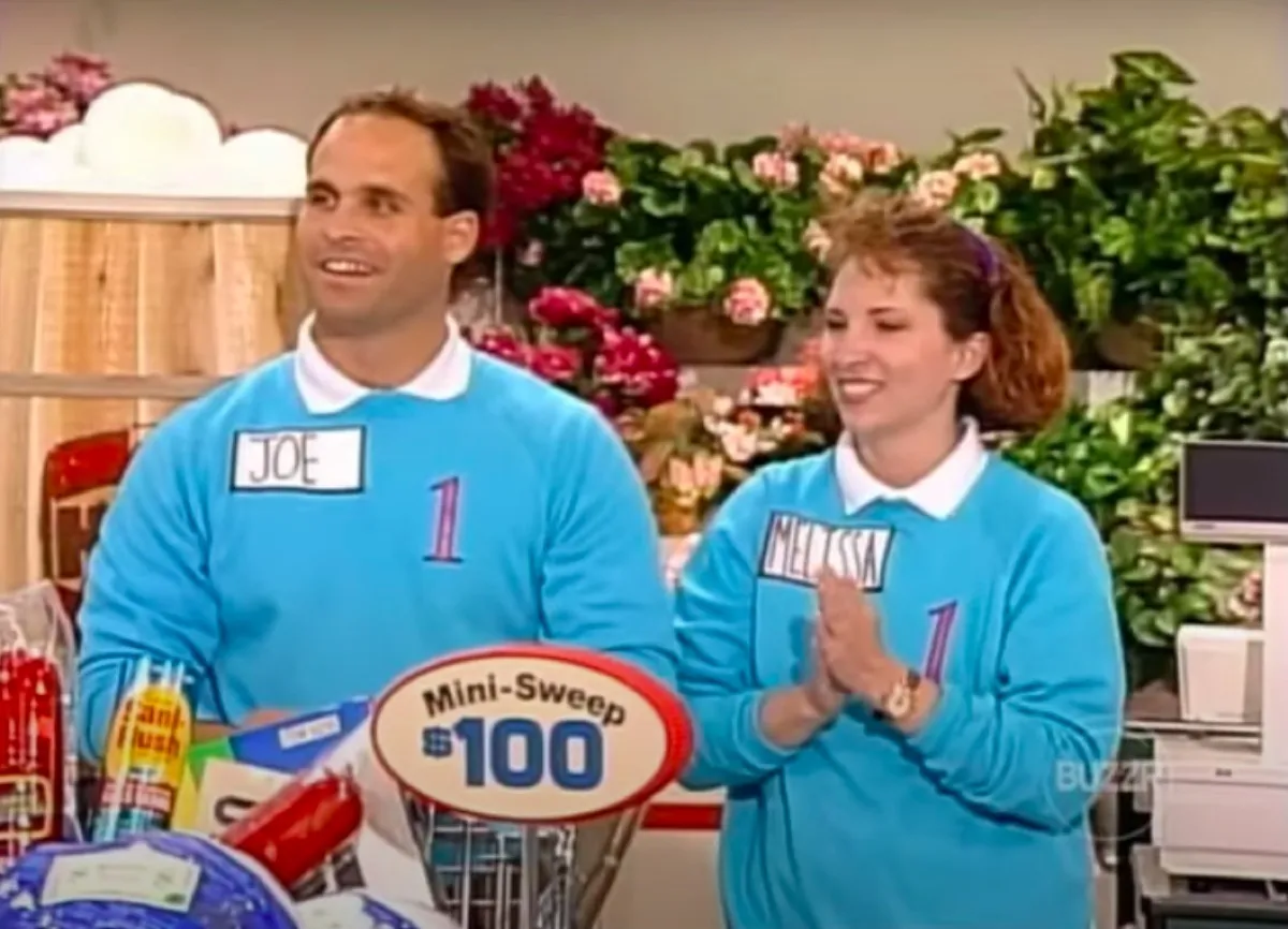 Supermarket Sweep team in matching sweatshirts