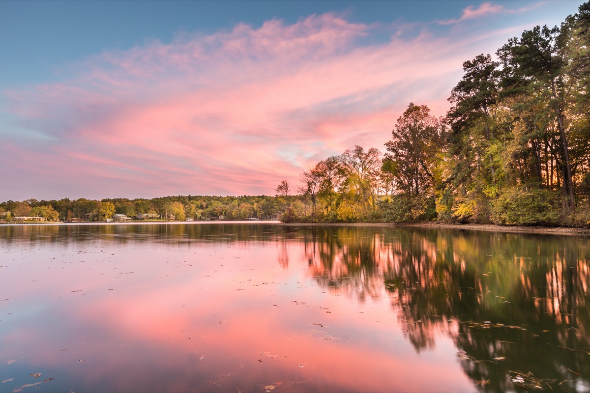 green trees and Hamilton Lake at sunset in Garland County, Arkansas