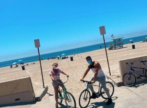 britney spears and sam asghari riding bikes at the beach