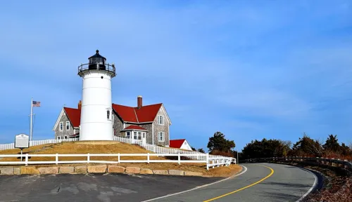 lighthouse, townhouse, and empty road in Cape Cod, Massachusetts