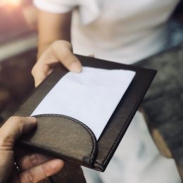 Couple getting the check at dinner who should pay