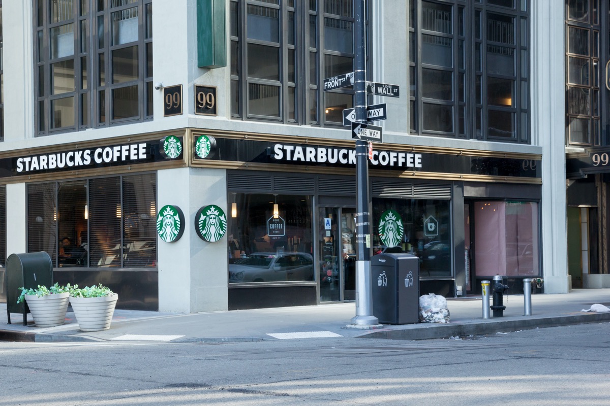 A Starbucks on the corner of Front Street and Wall Street in Manhattan's Financial District; New York City; Photo taken on April 6, 2014; editorial use only (A Starbucks on the corner of Front Street and Wall Street in Manhattan's Financial District;