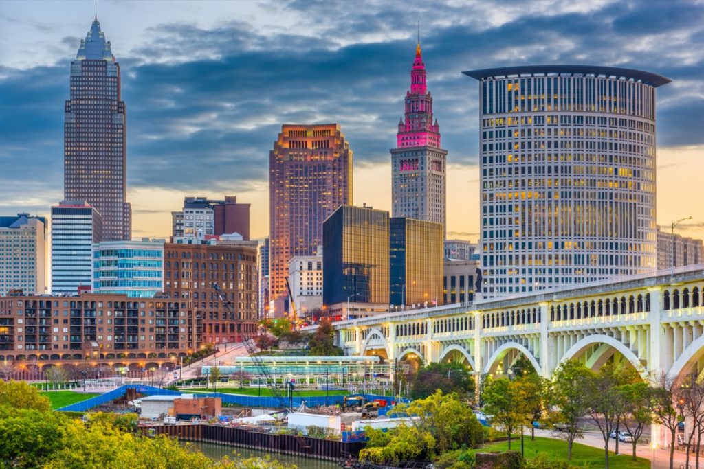 city skyline on the Cuyahoga River in Cleveland, Ohio at dusk
