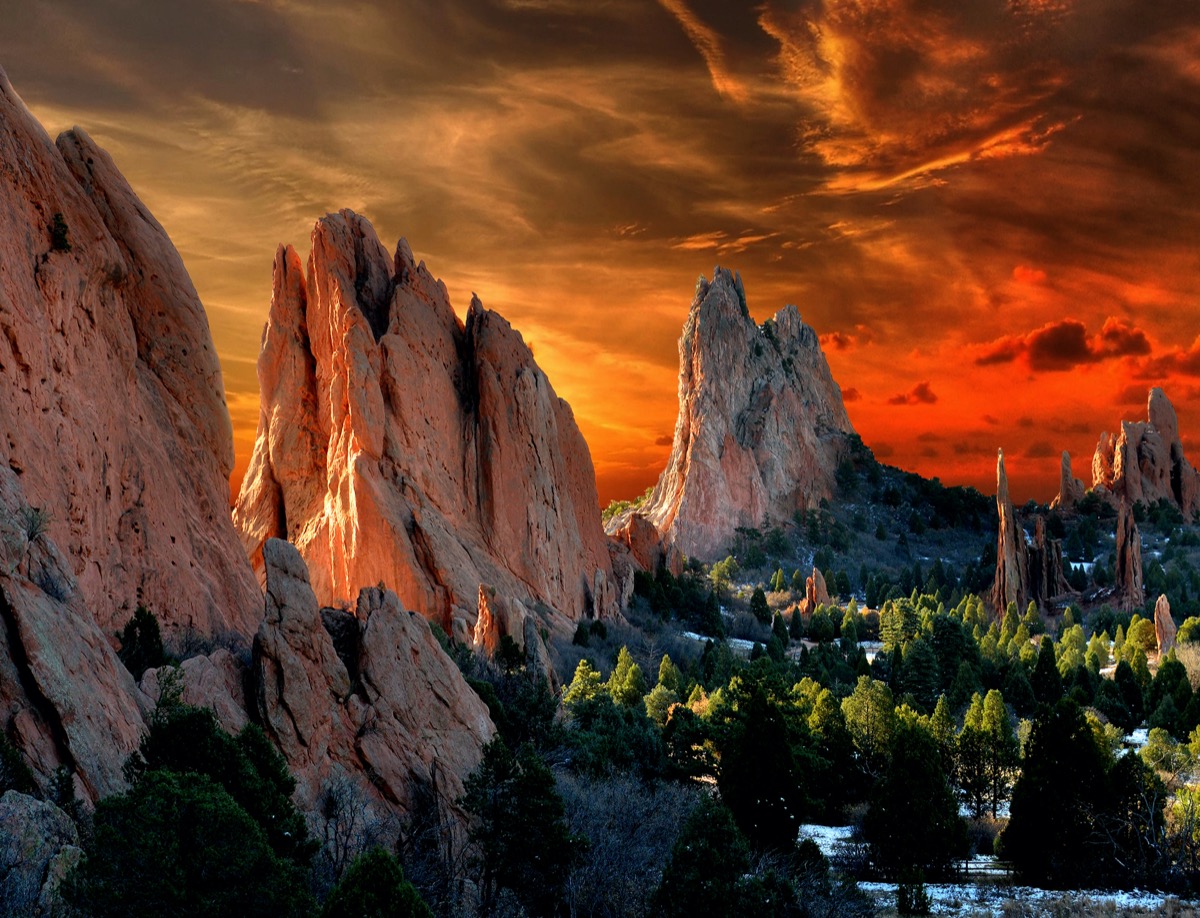 tall beige rocks and green trees at the Garden of the Gods in Colorado Springs, Colorado