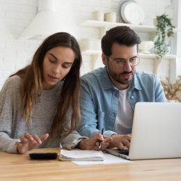 Couple stressed while working on their finances