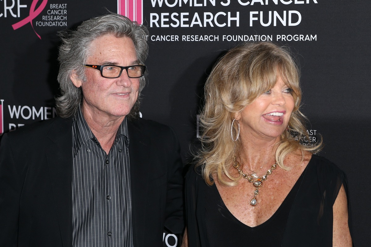 Kurt Russell wears a black suite and Goldie Hawn wears a black dress at the Women's Cancer Research Fund in 2019