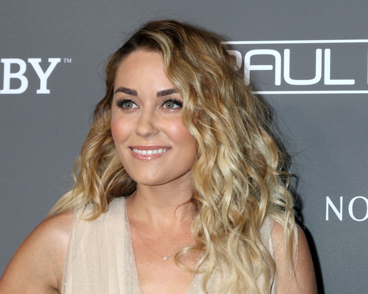 lauren conrad with curly hair on step-and-repeat