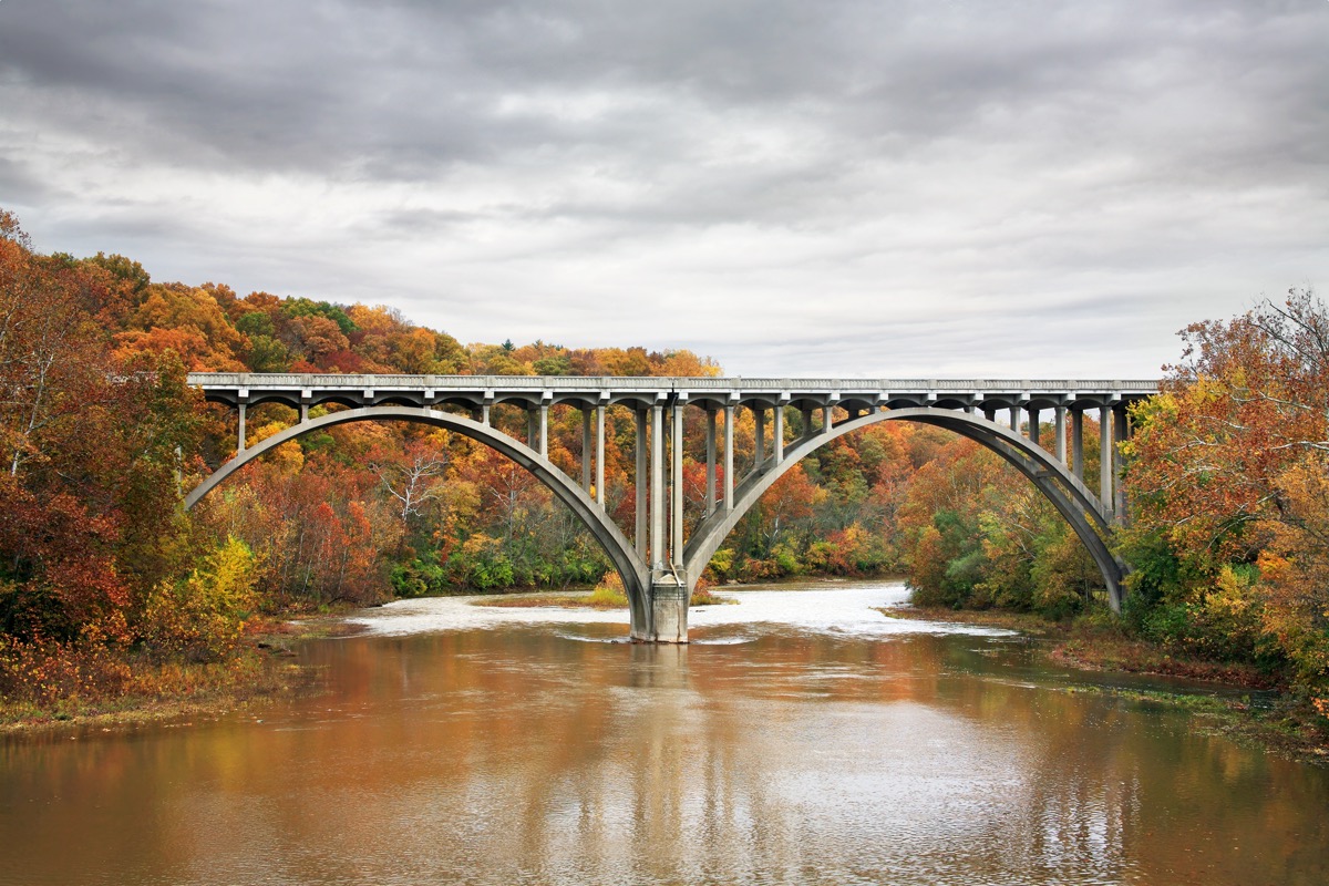 autumn trees and the Roadway Bridge over the Little Miami River in Ohio