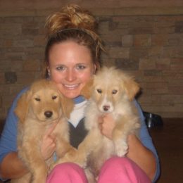 miranda lambert holding two puppies
