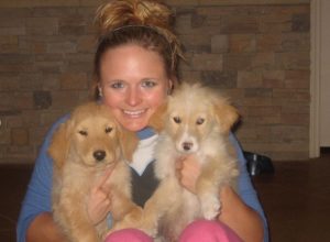 miranda lambert holding two puppies