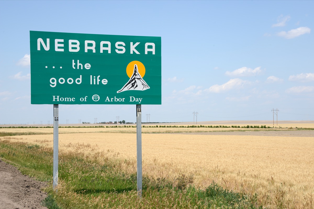 a green "Nebraska...the good like" sign off of a highway