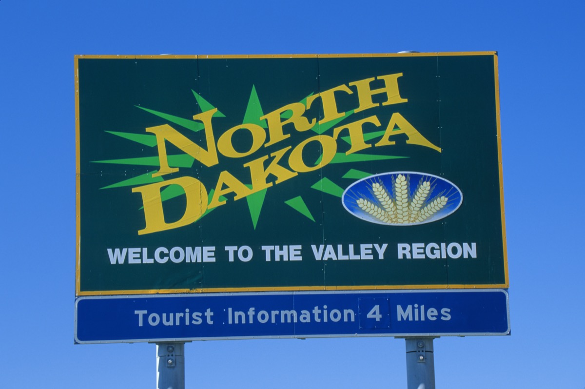 a green "North Dakota" road sign