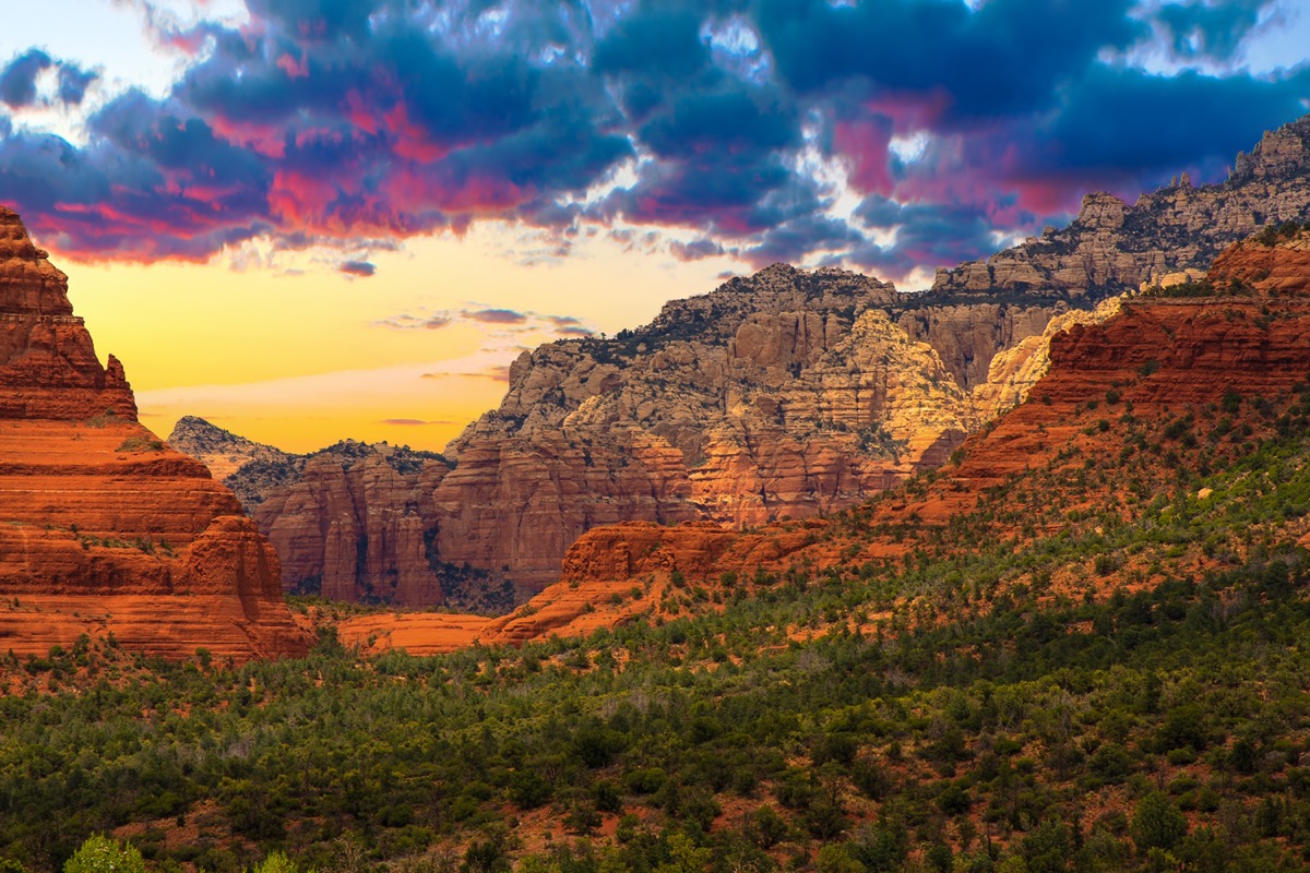 red mountains and green trees at sunset in Sedona, Arizona