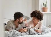 Couple having a serious talk in bed