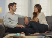 Couple talking on the couch expressing gratitude