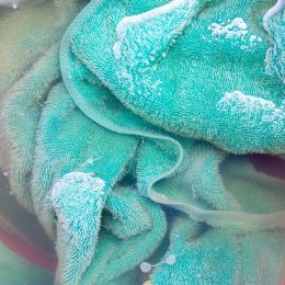 dirty green towel in laundry