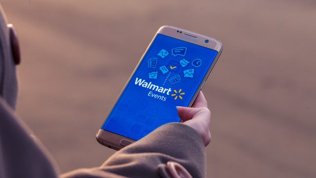 Woman looking at Walmart site on phone