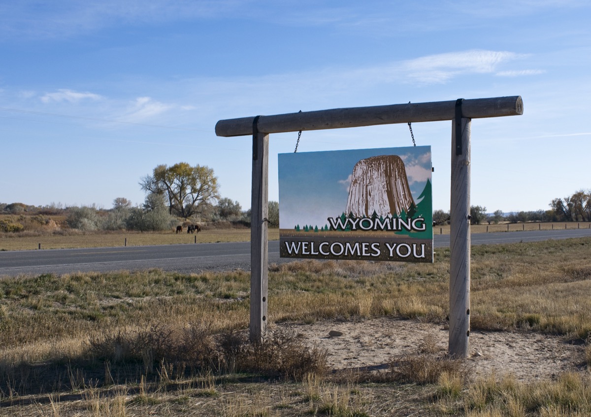 a "Wyoming Welcomes You" sign off of a highway