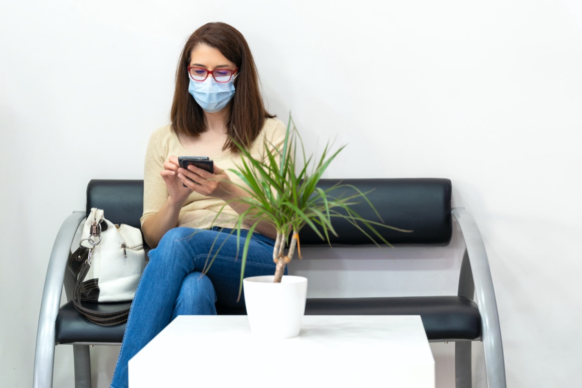 young white woman wearing mask at appointment