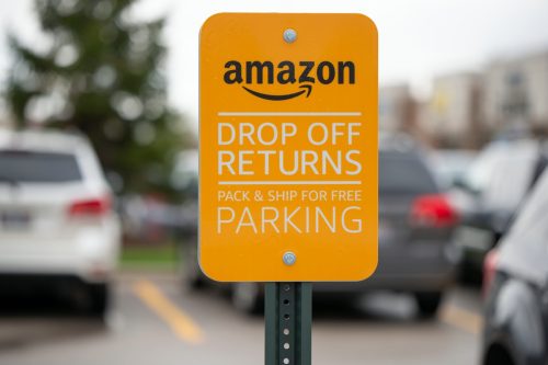 South Elgin, Illinois - Circa 2019: An Amazon Drop Off or Return sign outside of a Koh's department store.