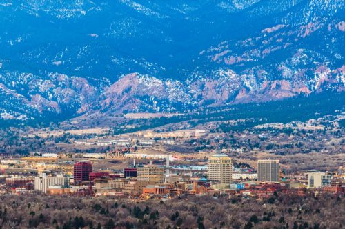 skyline and mountains in Colorado Springs, Colorado at dusk