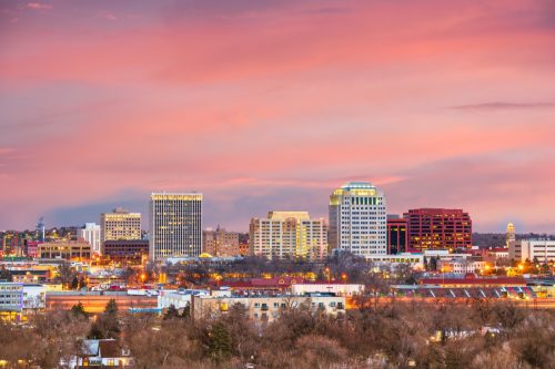 cityscape photo of buildings and tress in Colorado Springs, Colorado at sunset