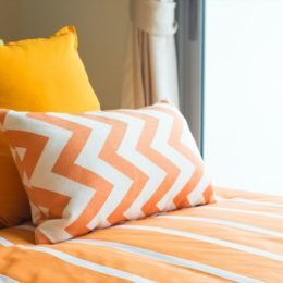 bed with colorful yellow bedding