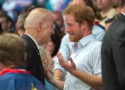 Prince Harry of Wales and Vice President Joe Biden bump into each other in the stands of a wheelchair rugby match during the 2016 Invictus Games at the ESPN Wide World of Sports Complex May 11, 2016 in Orlando, Florida