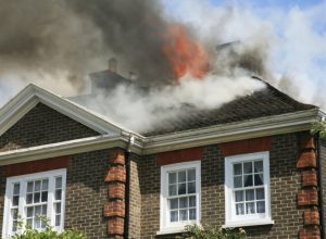 house with roof on fire